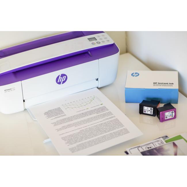 A HP DeskJet 3755 All-in-One and HP Instant Ink Welcome Kit being used to print a report.