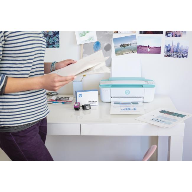 A girl printing a report on a HP DeskJet 3755 All-in-One using a HP Instant Ink Welcome Kit.